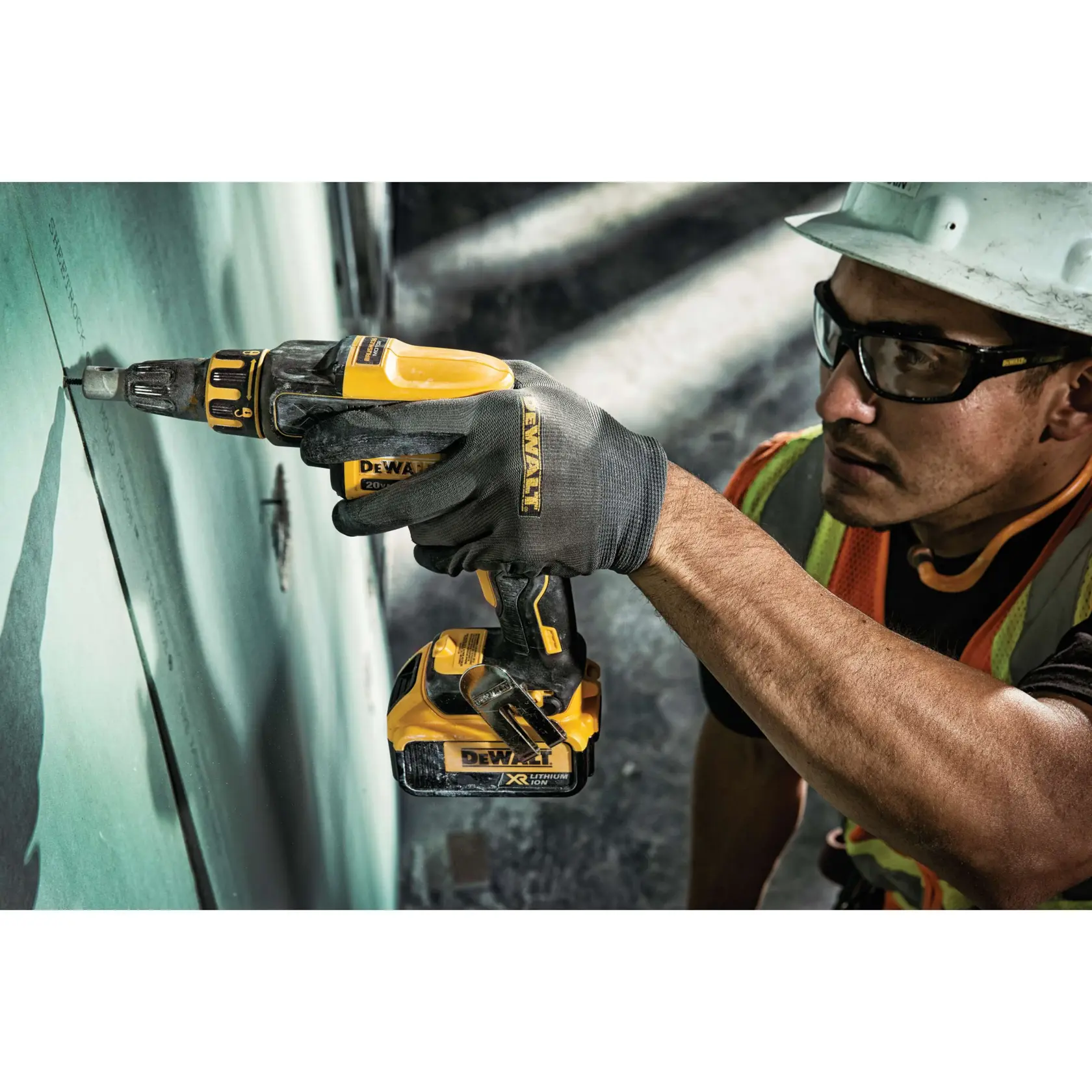 DEWALT converter safety glasses/goggles being worn by a person using a power tool.