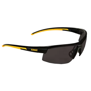 A pair of DEWALT branded safety glasses with black and yellow arms and dark tinted lenses, photographed on a white background.