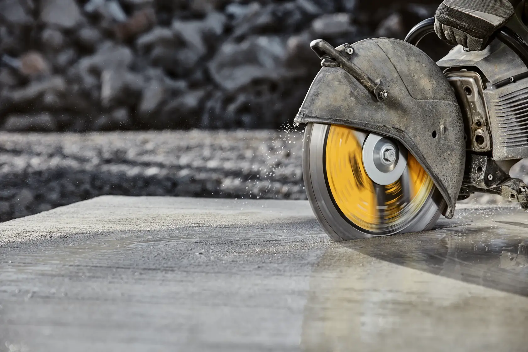 Close up of XP4 all purpose segmented diamond blades cutting hard concrete.