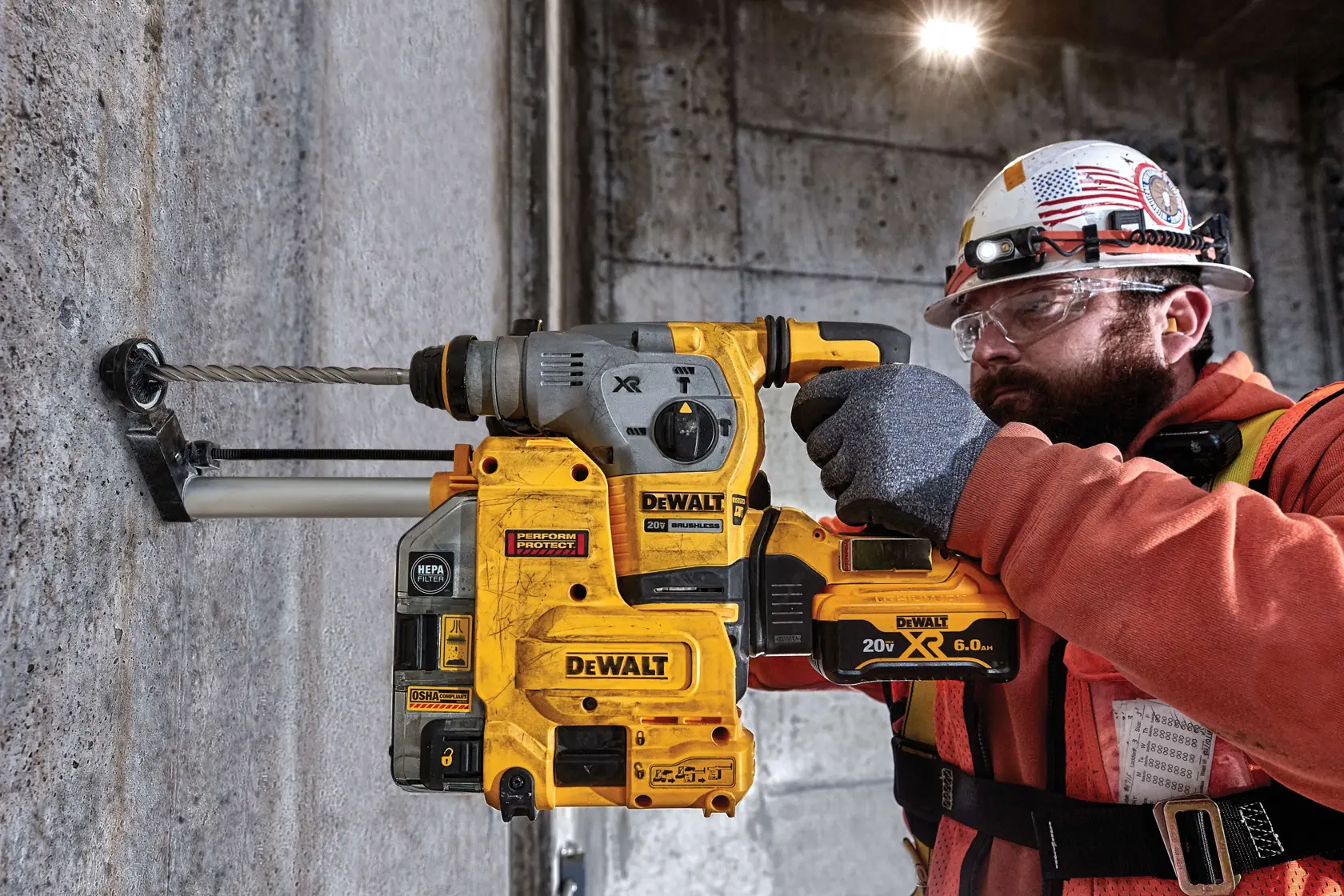 SDS Plus 2 Cutter Drill Bit being used by worker to drill hole through concrete wall at work site.