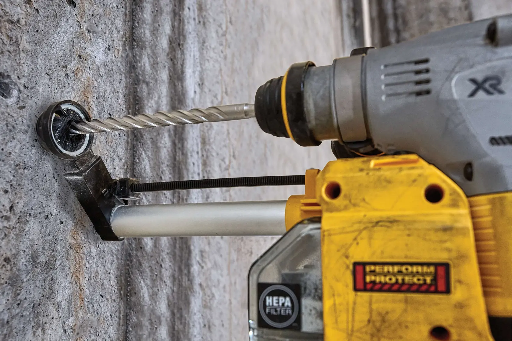 9 sixteenths inch by 4 inch by 6 inch S D S plus 2 cutter drill bits drilling hole.