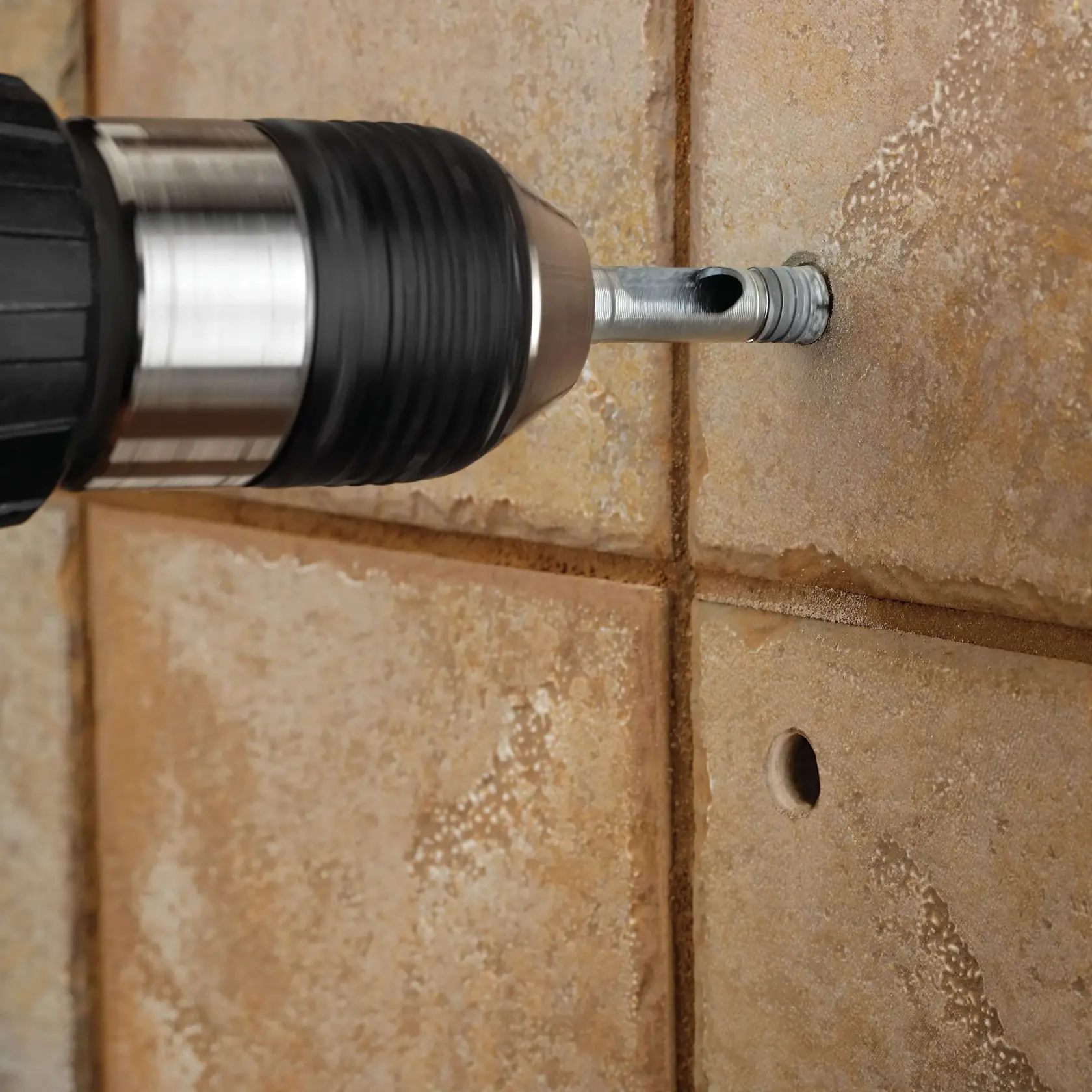 Tile Drill Bits Family being used to drill through dense tile.