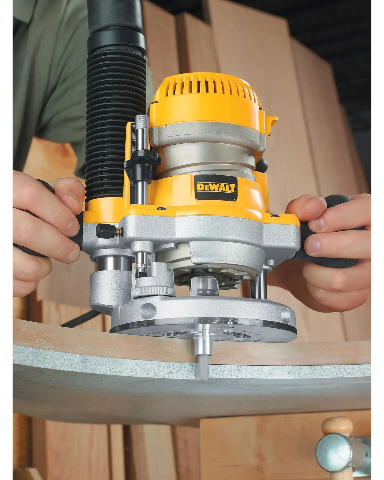 Plunge Base for Routers being used on edge of wooden surface.