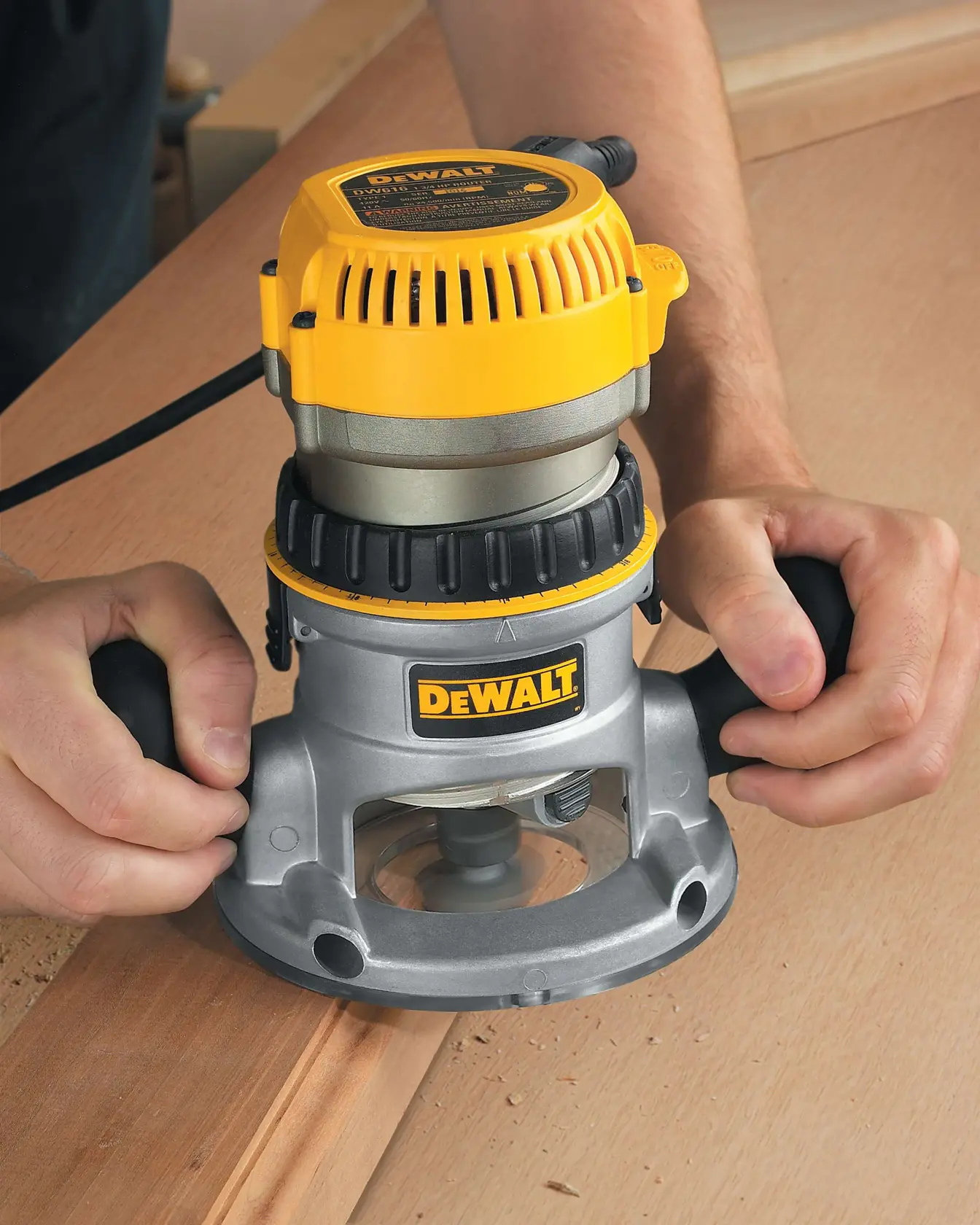 HP EVS Fixed Base Routers with Soft Start being used on wooden surface.