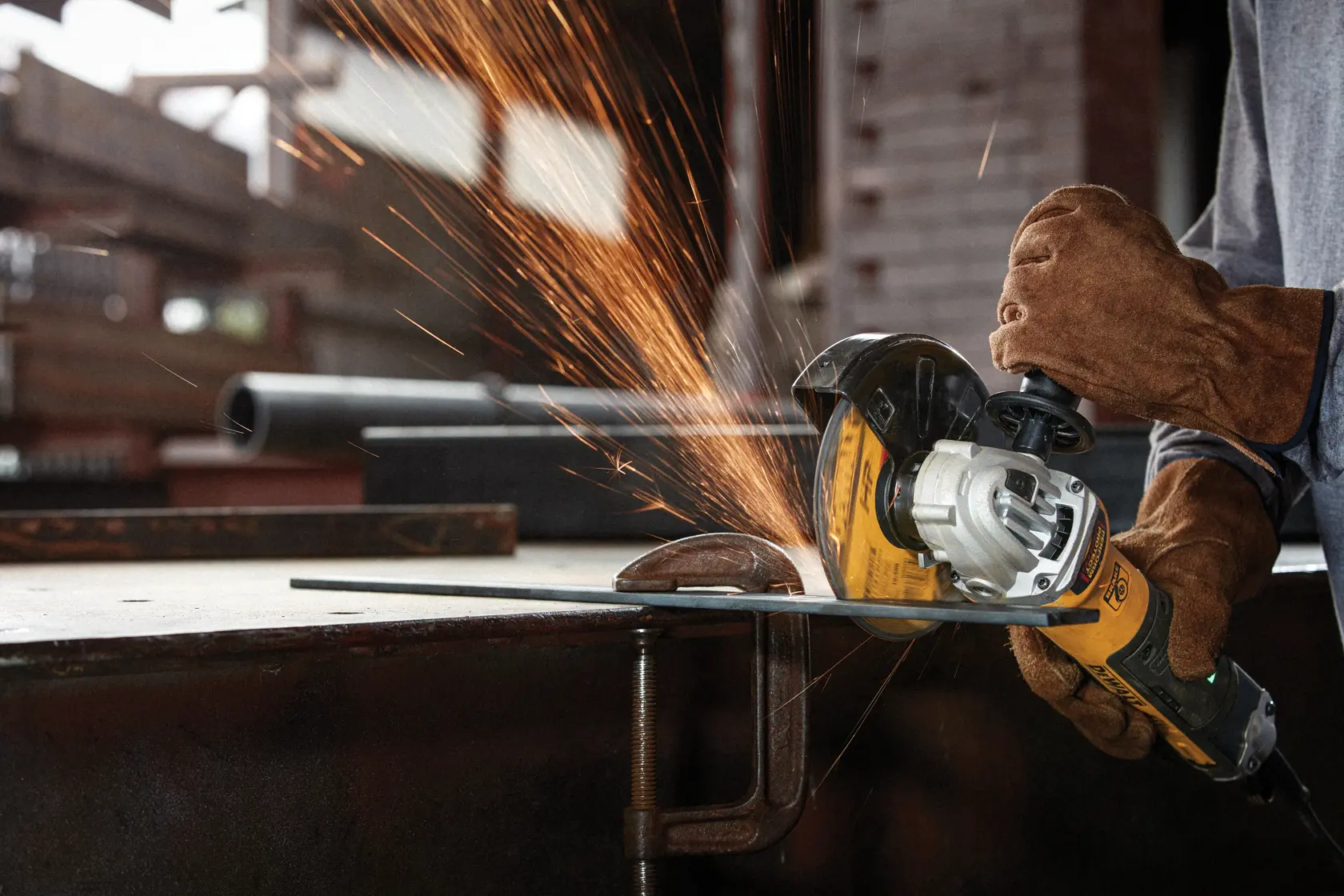 Metal and Stainless Cutting Wheel being used to slice a metal tube.