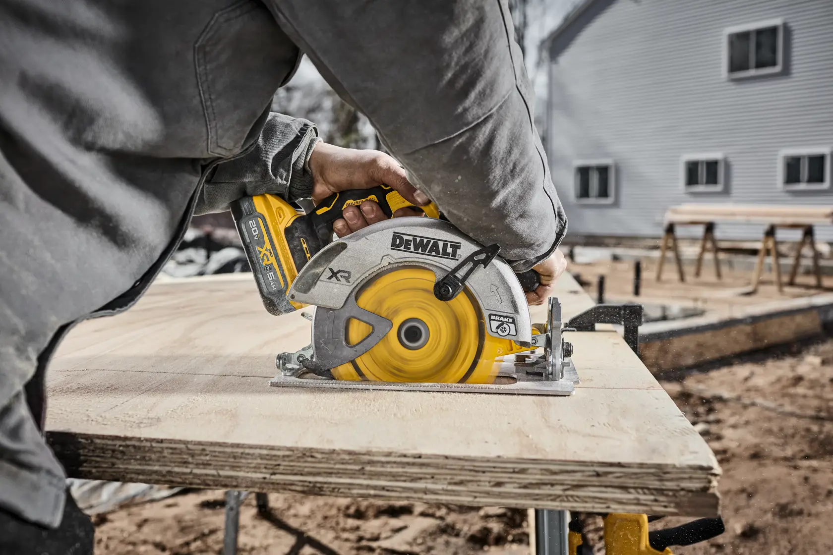 DEWALT circular saw blade cutting wood on residential jobsite