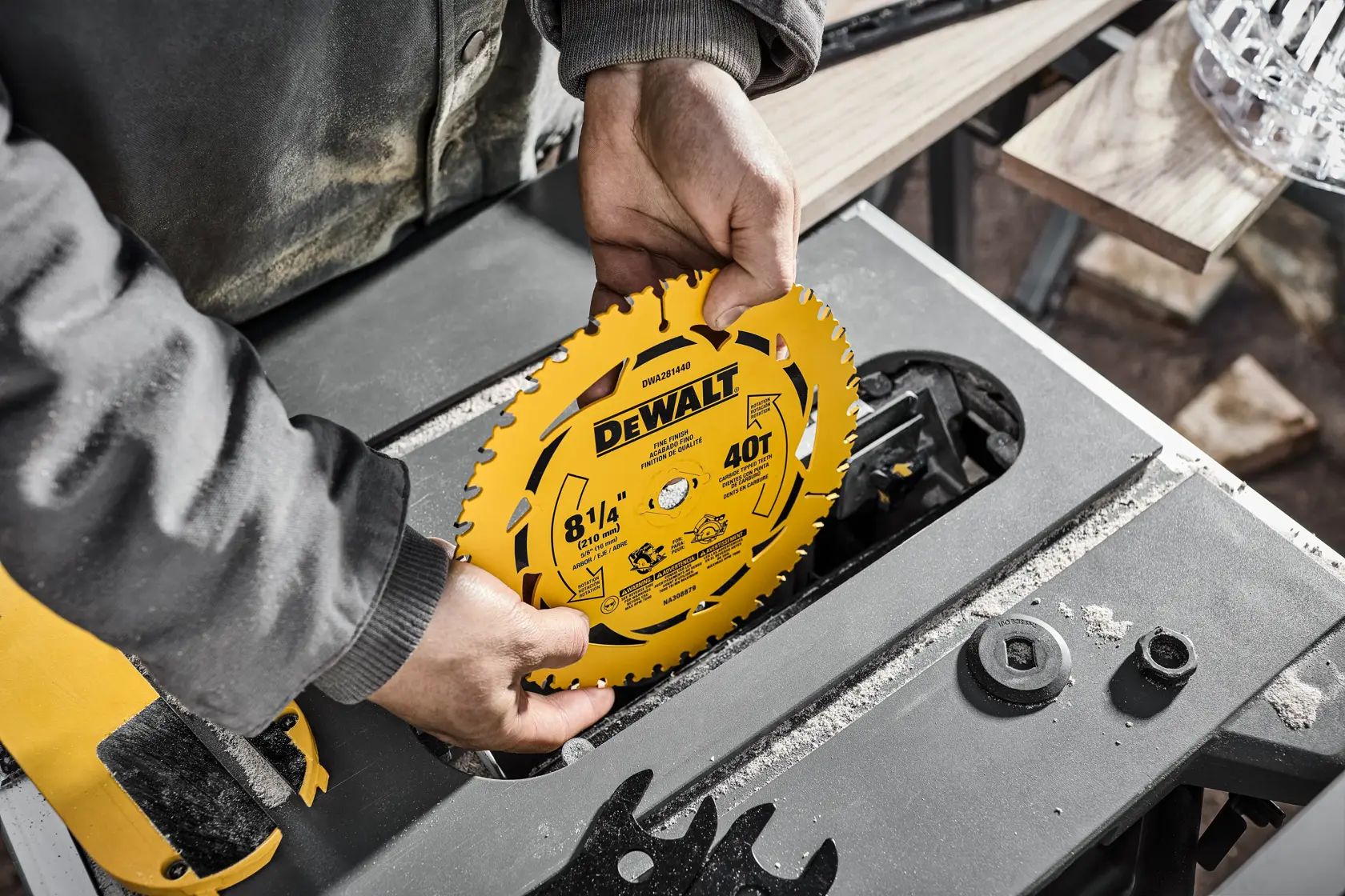 DEWALT table saw blade being placed in saw
