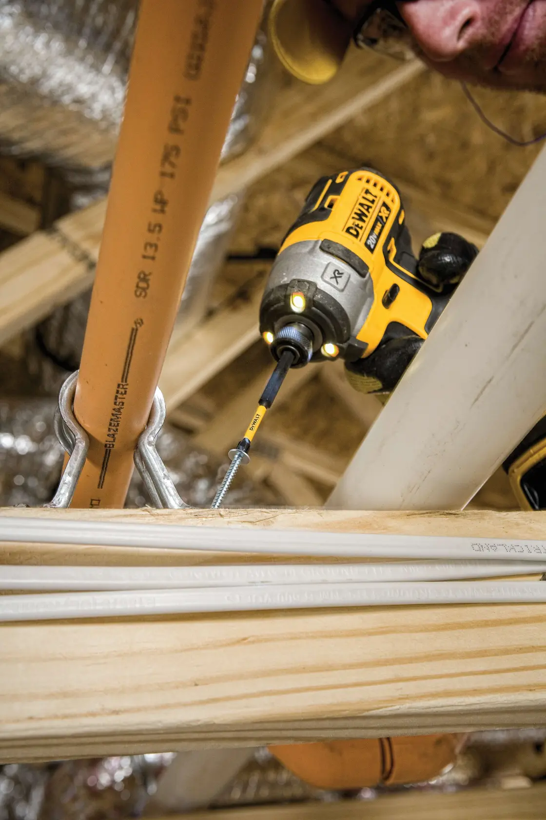 Phillips Impact Ready Bit being used on a drill by a workman.