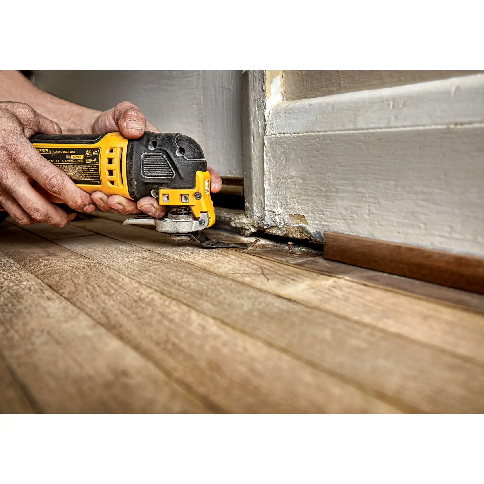 1 three eighth inch Carbide Blade being used on floor skirting by person.