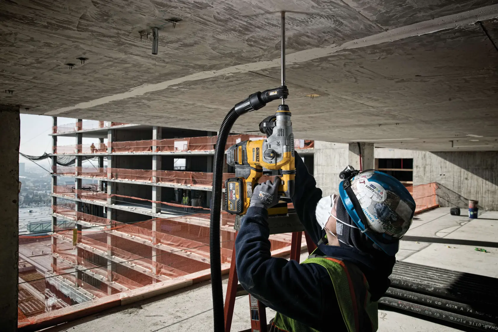 SDS Max Hollow Bits being used on roof at construction site by workman.