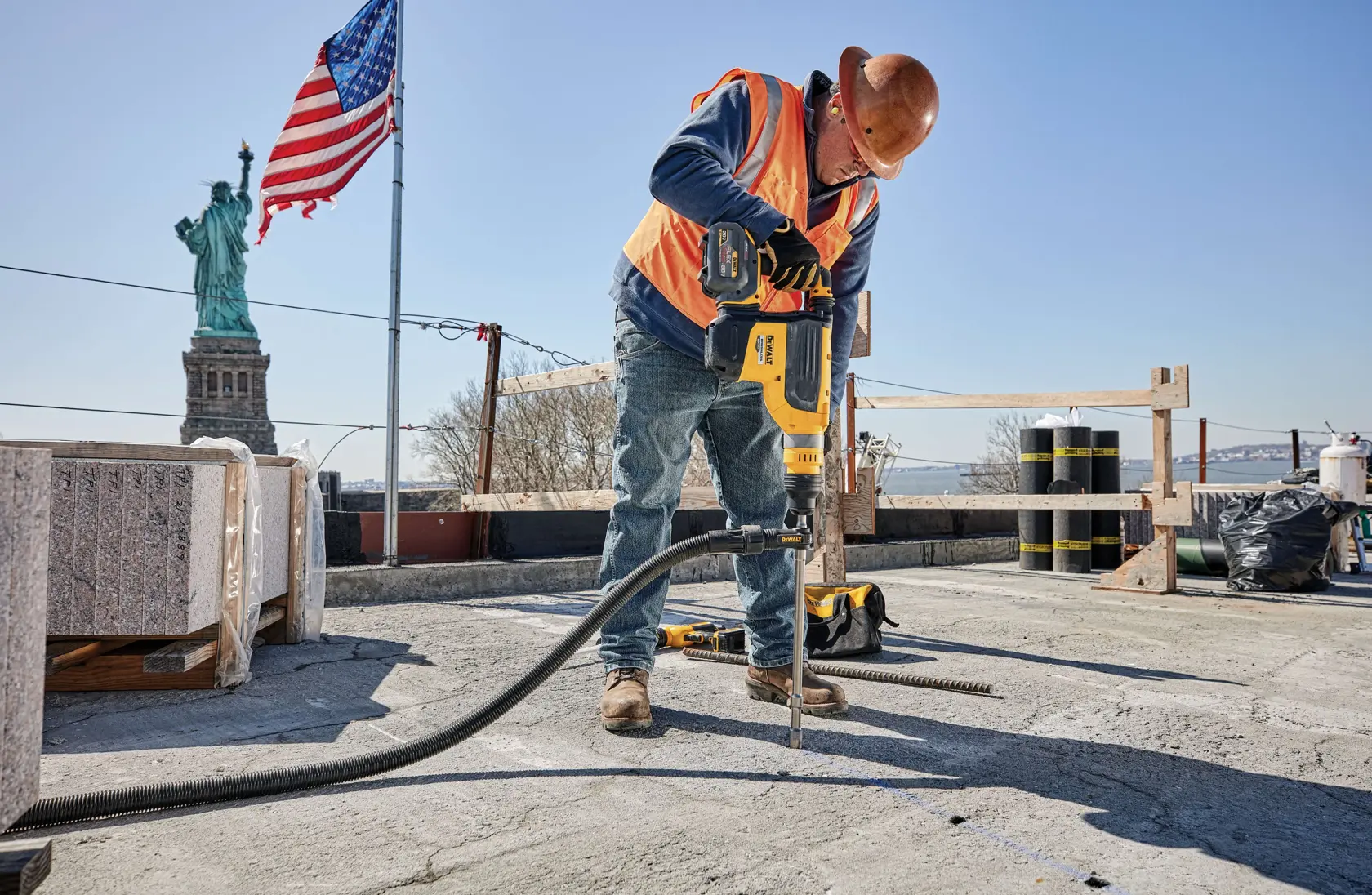 SDS Max Hollow Bit being used at construction site roof top by workman.