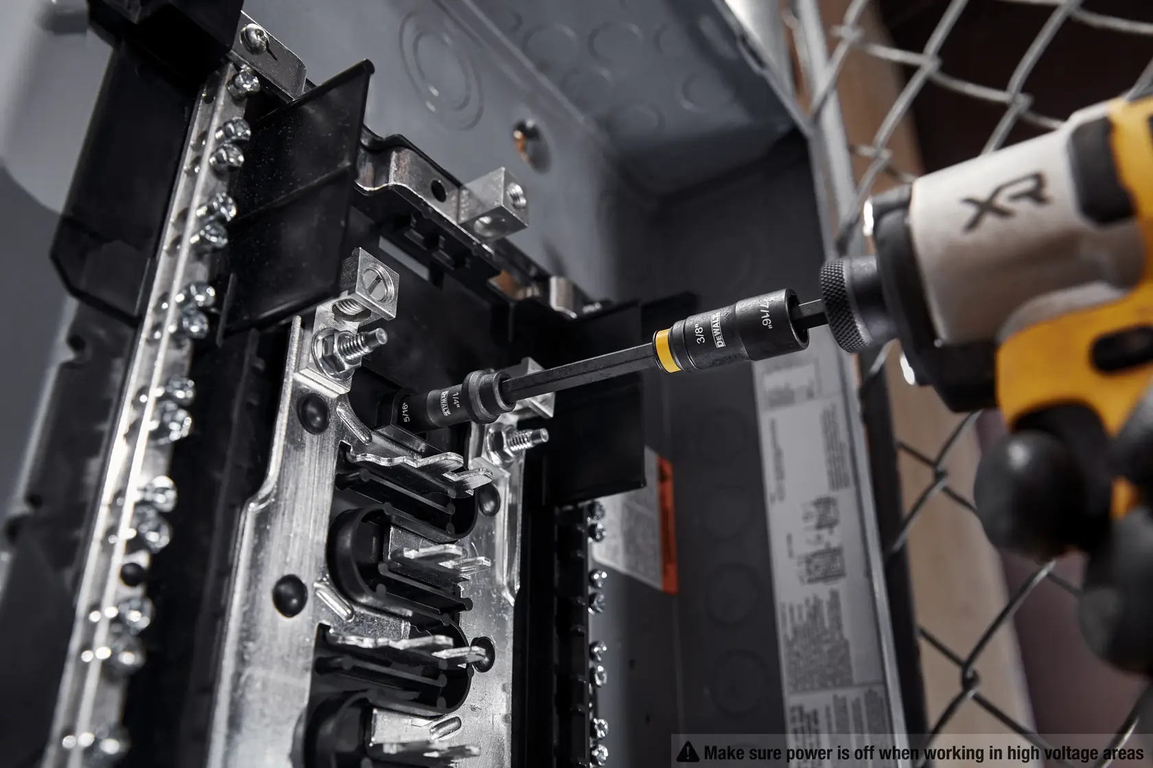 DEWALT Double ended nut driver taking out nut in an electrical box