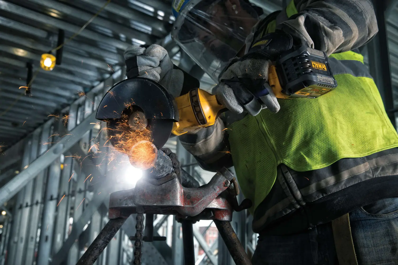FLEXVOLT METAL CUTTING WHEELS TYPE 1 being used by worker to cut cylindrical metal rod at worksite.