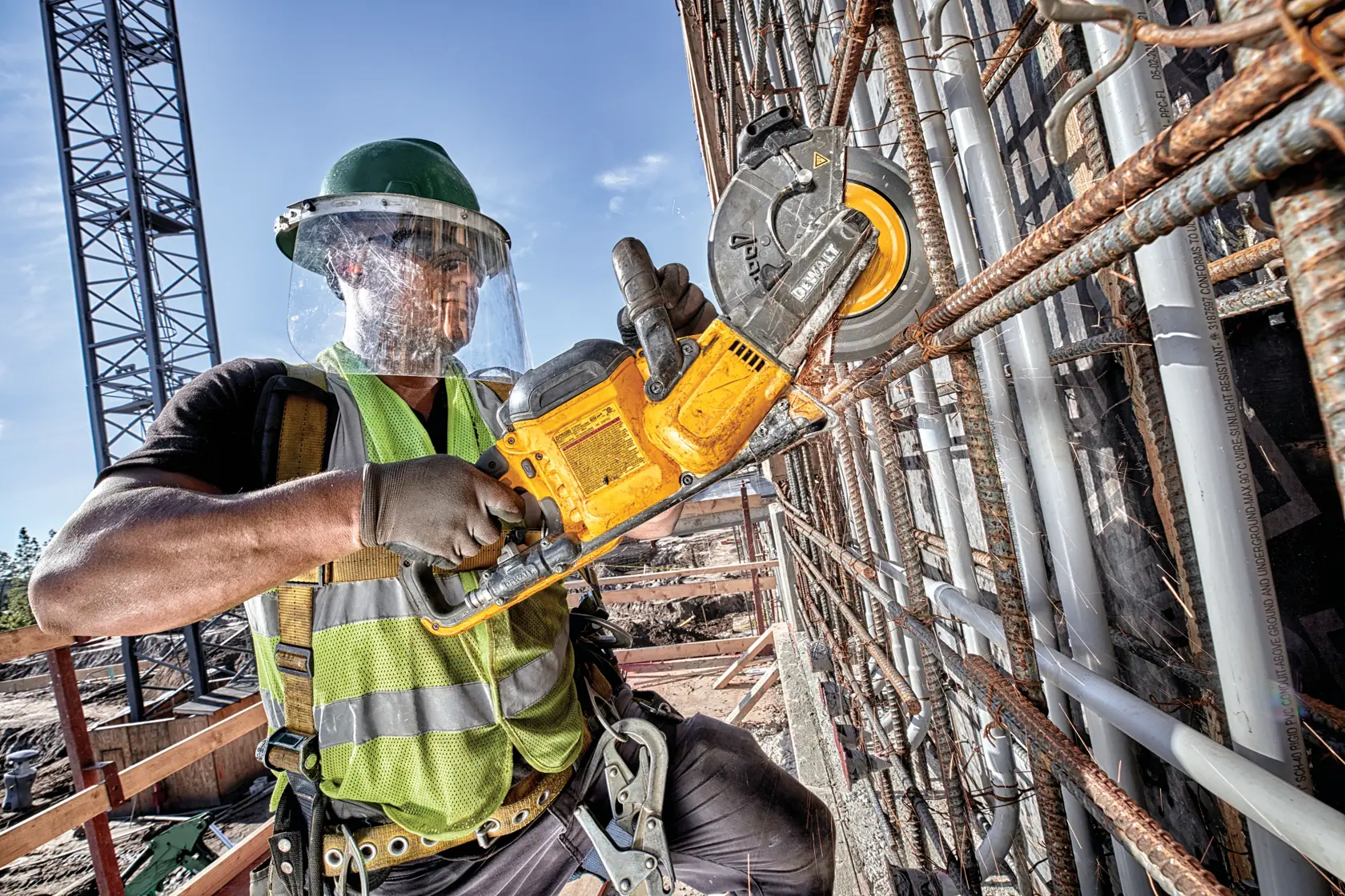 FLEXVOLT 9 inch metal cutting diamond wheel being used by a person outdoors.