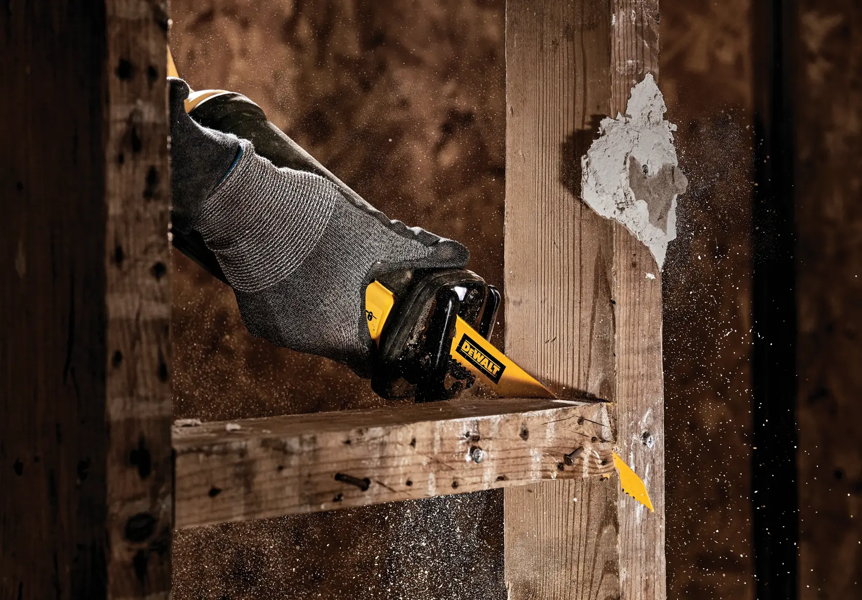 demolition bimetal reciprocating saw blade being used by a person.