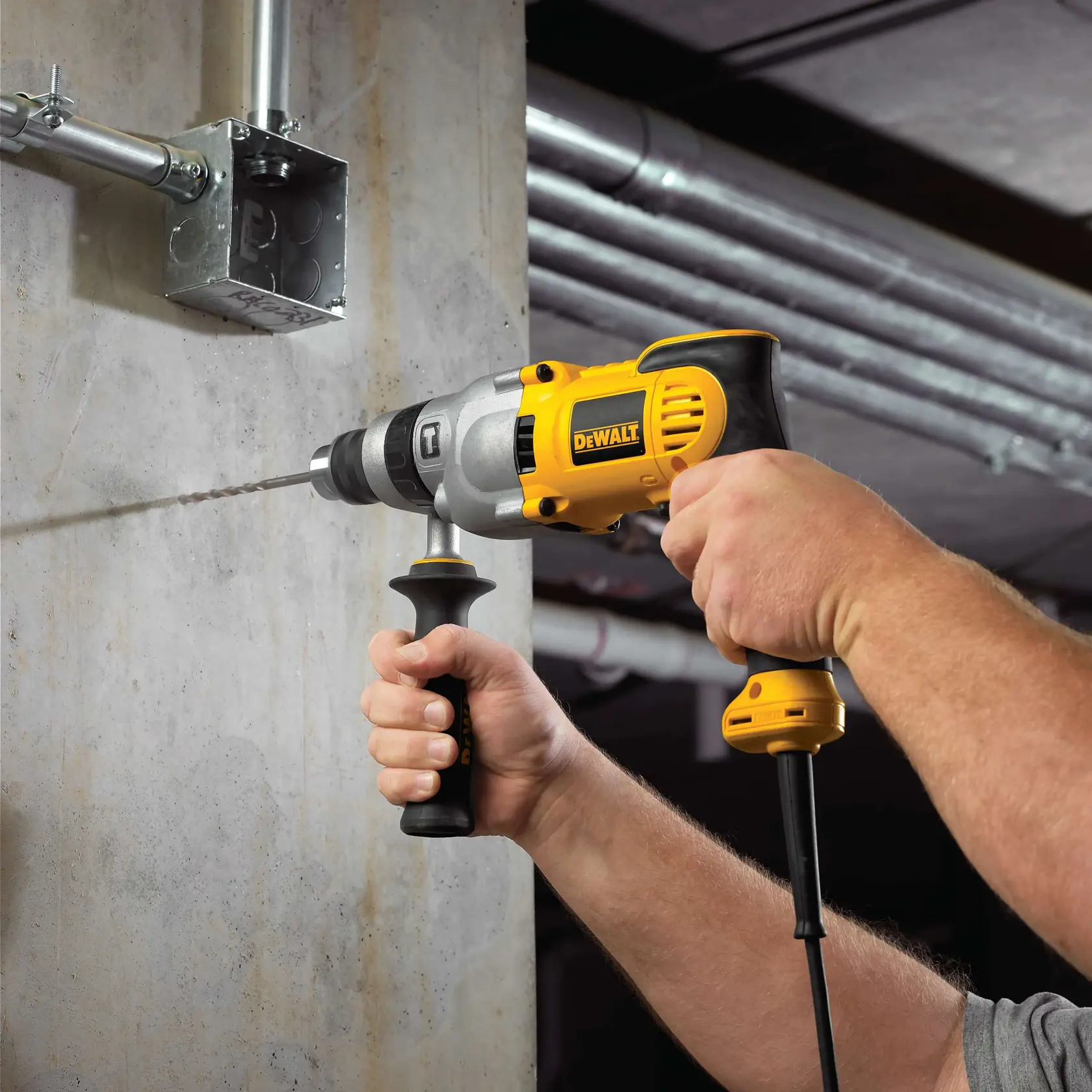 V S R pistol grip hammerdrill kit being used by a construction worker.