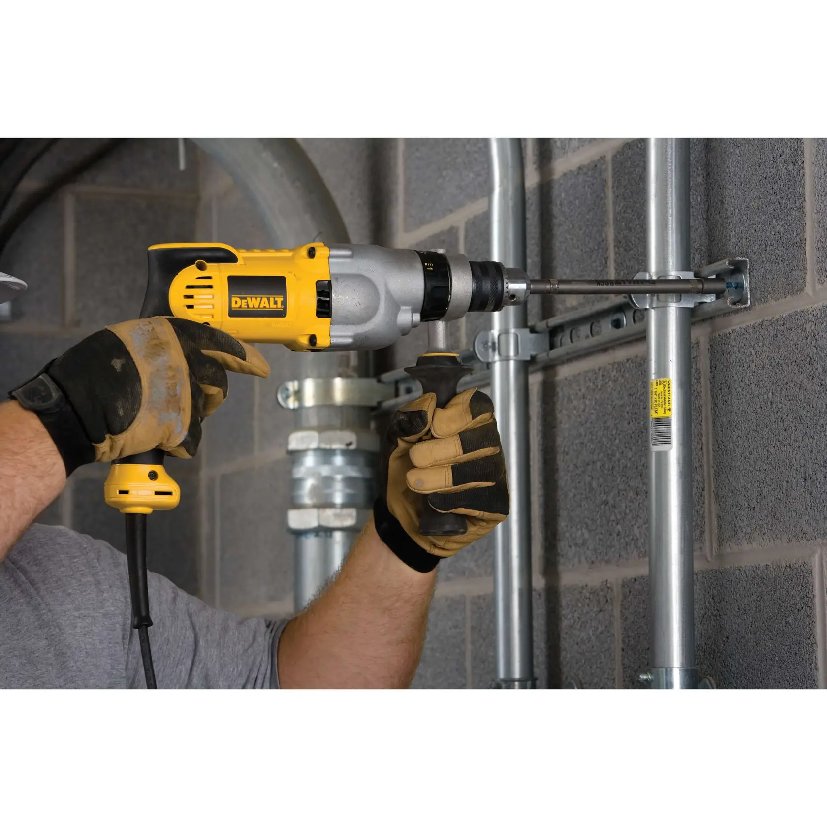 V S R pistol grip hammerdrill being used to drill into ceiling.