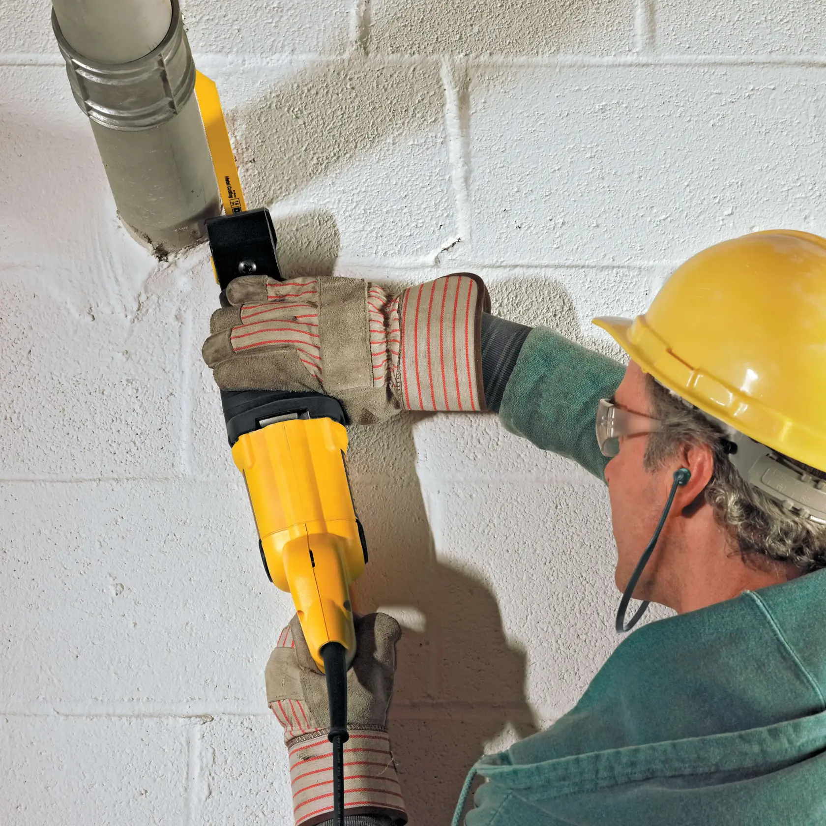 10 ampere reciprocating saw being used to cut wood.