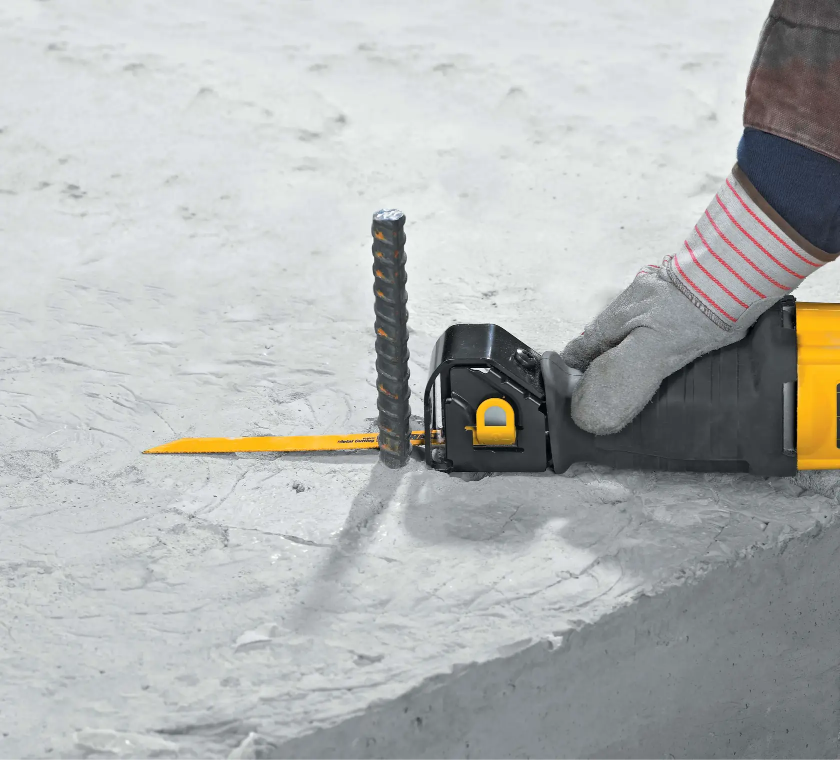 10 ampere reciprocating saw being used by a person to cut wood.