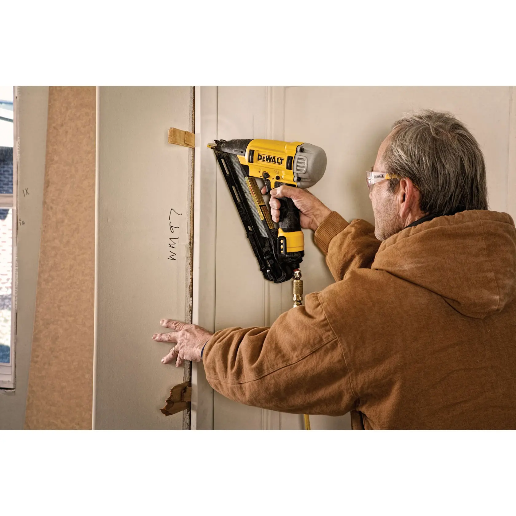 15 gauge Precision point DA style angle finish nailer being used by a person for interior trim.