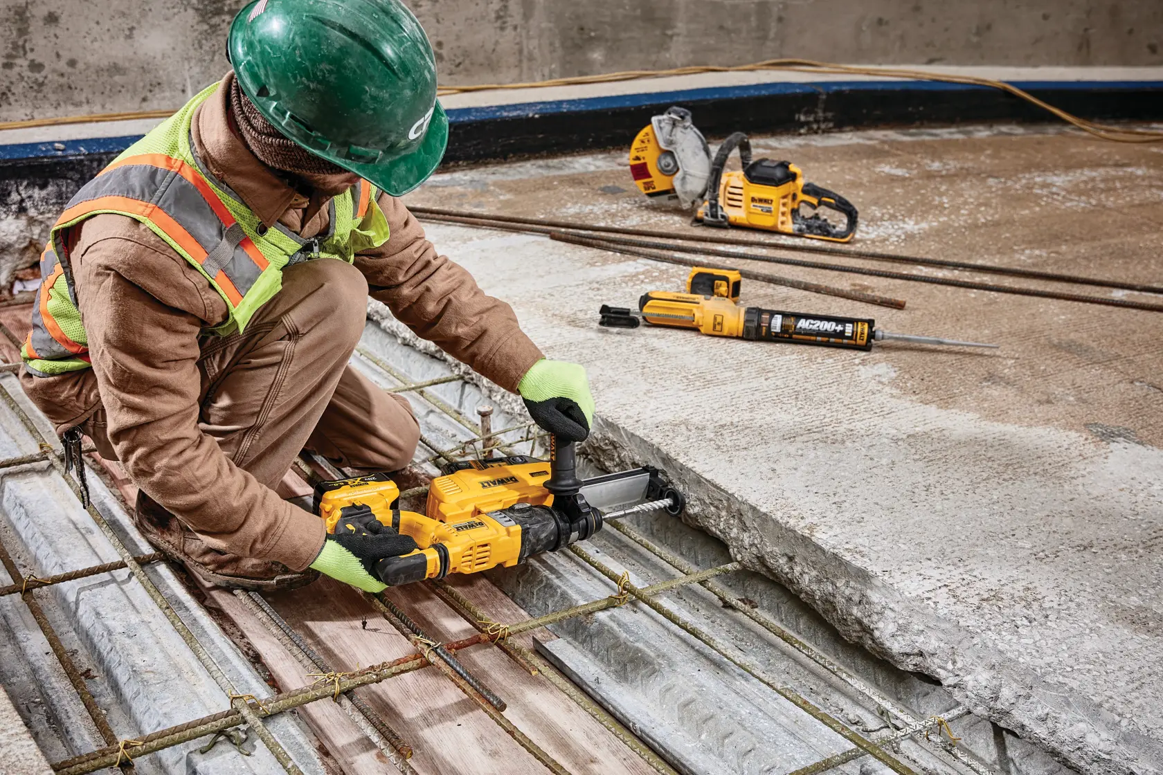 Close up of Dust extractor being used by a person to drill.
