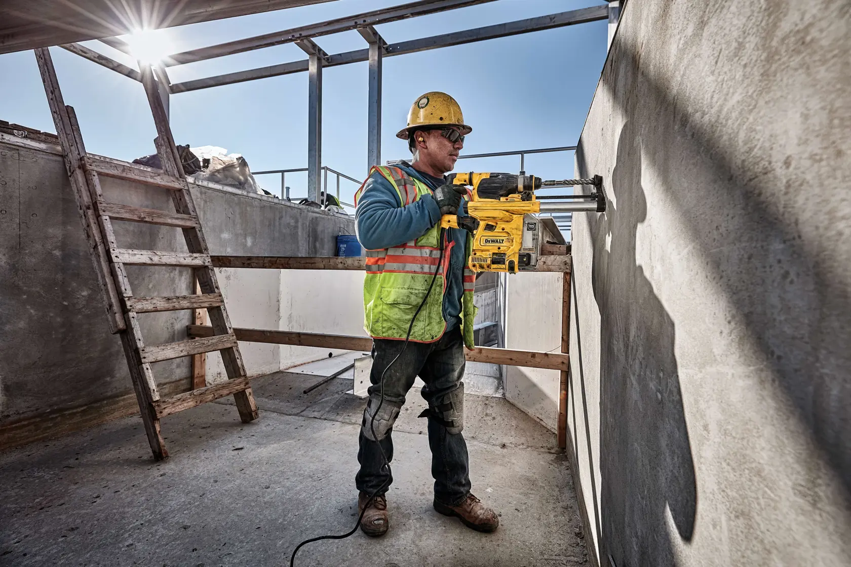 Onboard Dust Extractor for 1 and and one eighth inch slotted drive shaft  plus hammers being used by a person to drill.rn