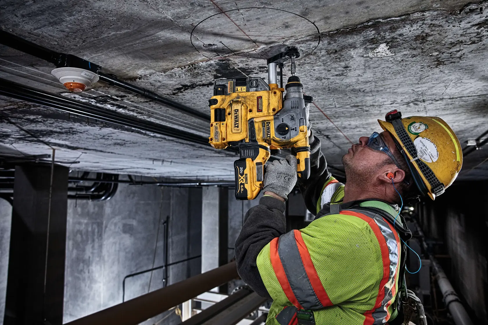 Onboard Dust Extractor for 1 and and one eighth inch slotted drive shaft  plus hammers being used by a person to drill.rn