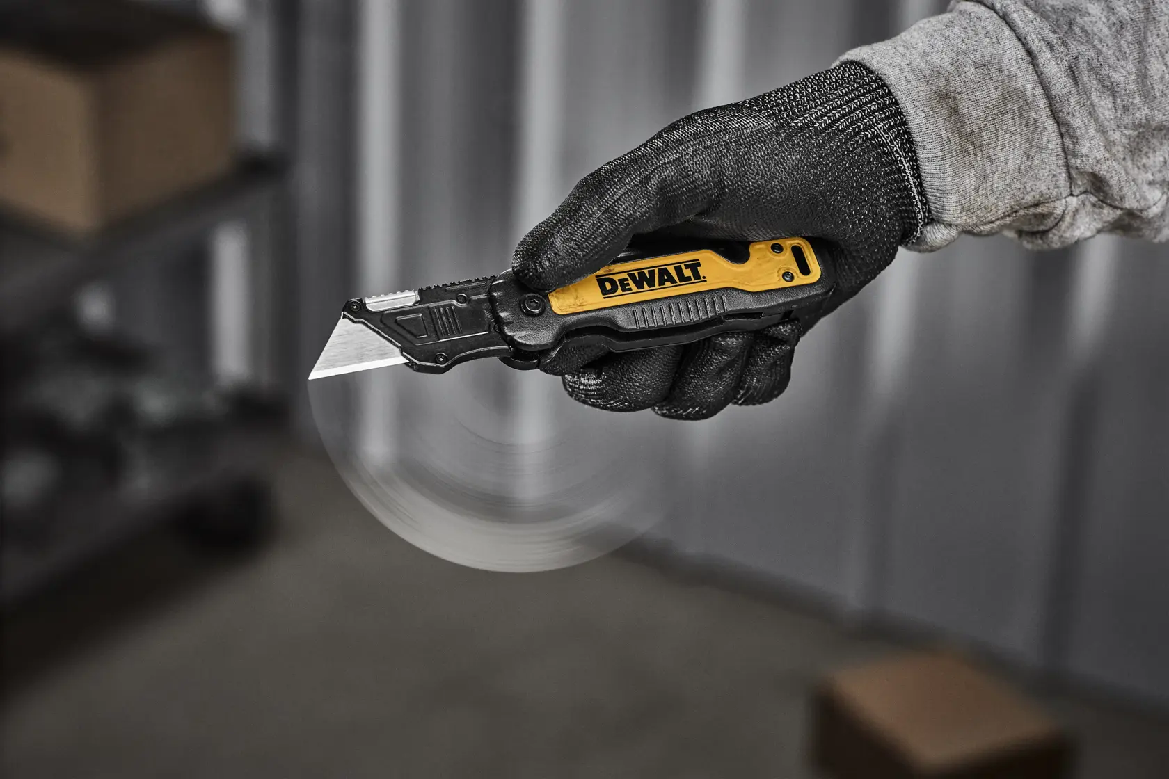 DEWALT knife being flipped open with one handed push to release