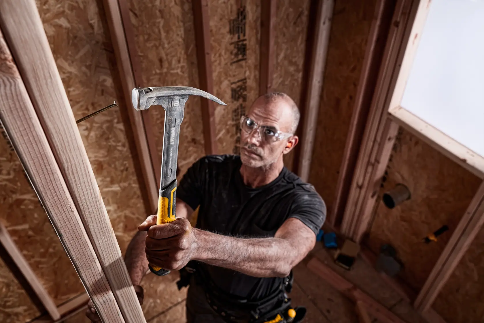 XP 1 Piece Steel MIG Weld Nailing Hammer being used by a person on nail in wood.