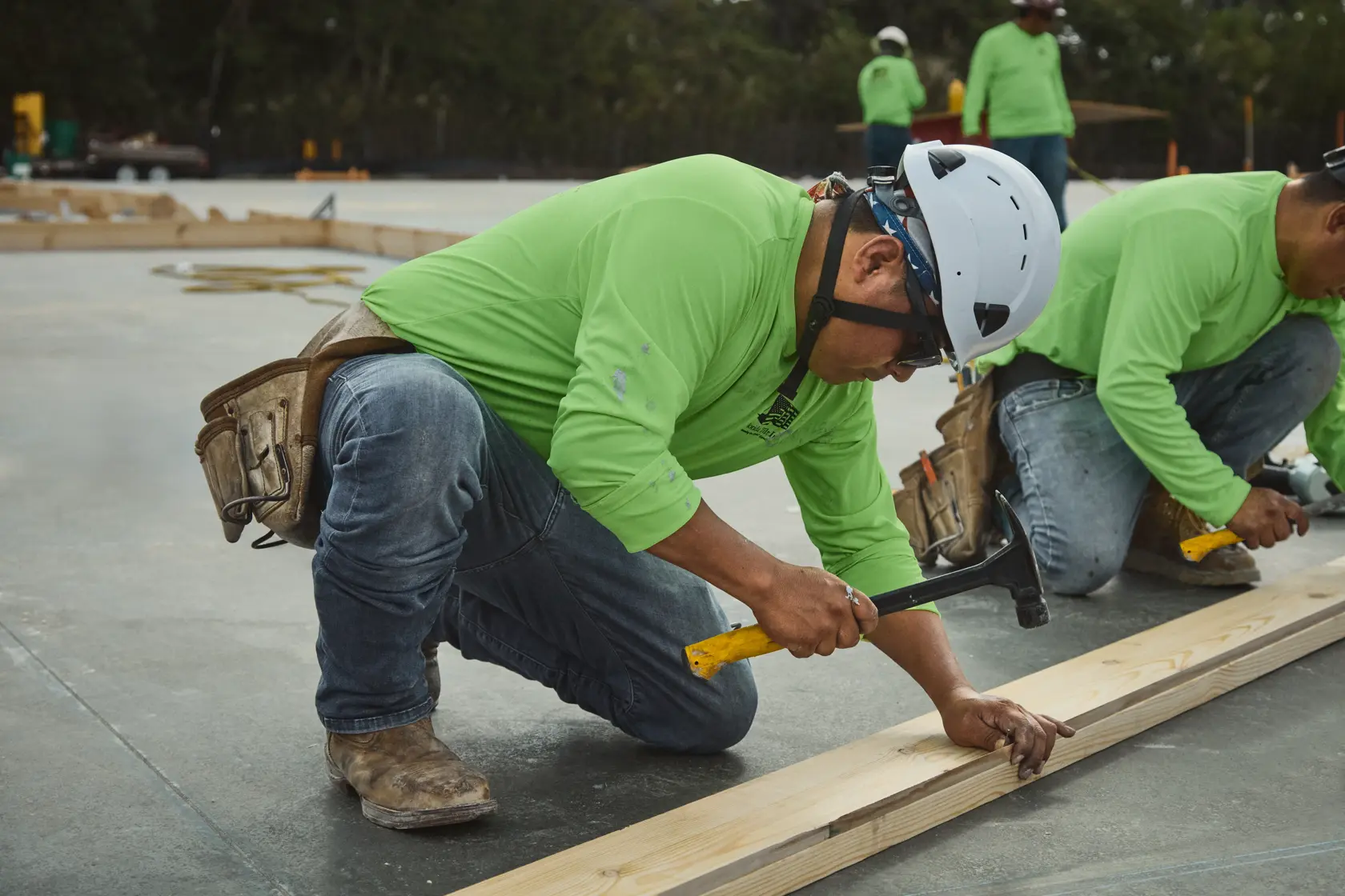 DEWALT TOUGHSERIES™ hammer hammering into wood beam