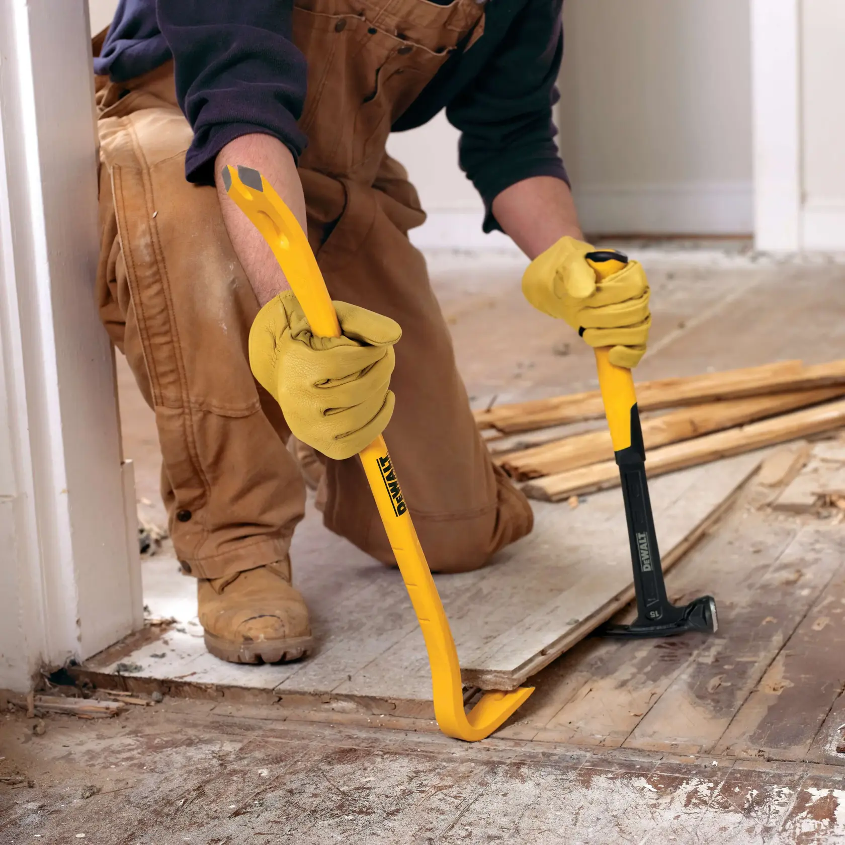 24 inch Wrecking Bar being used on wooden flooring with hammer.
