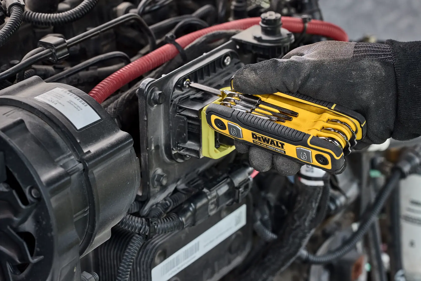 User tightening fastener on heavy machinery with the DEWALT TOUGHSERIES Folding Locking Hex Key