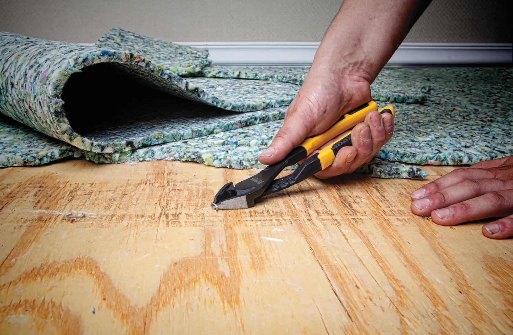 8 inch Diagonal Pliers with Prying Tip being used on metal wires by a person.