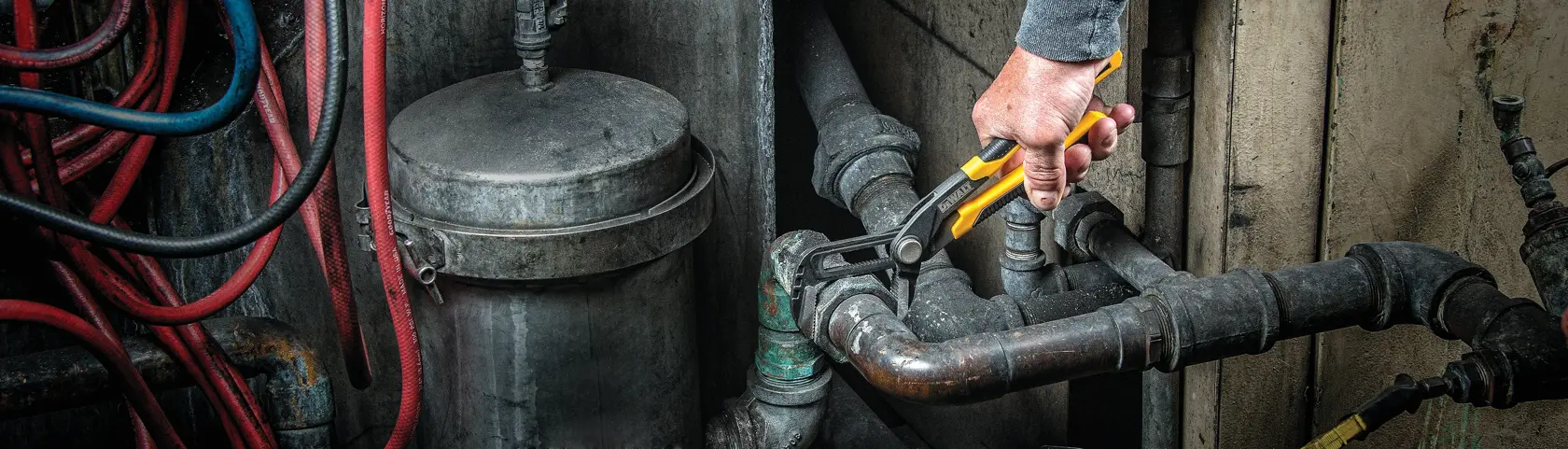 10 inch Straight Jaw Pushlock Pliers being used on a metal tube.