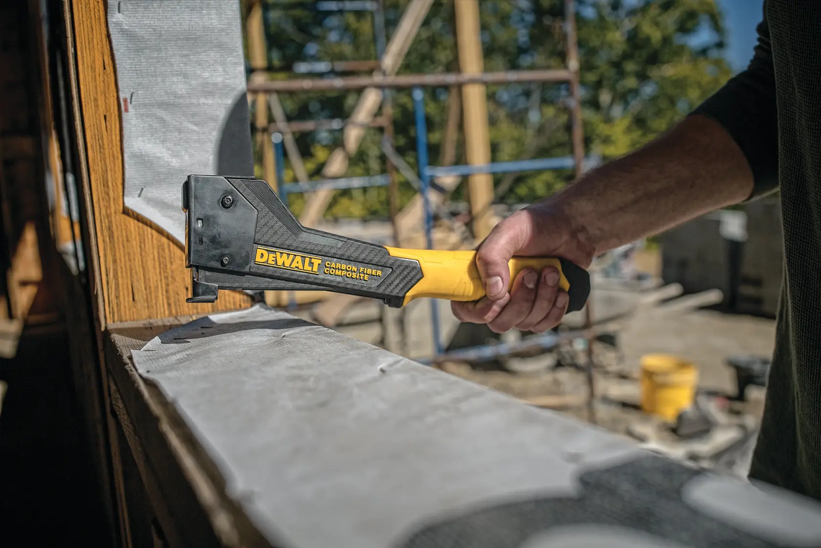 Carbon Fiber Composite Hammer Tacker being used on a construction site.