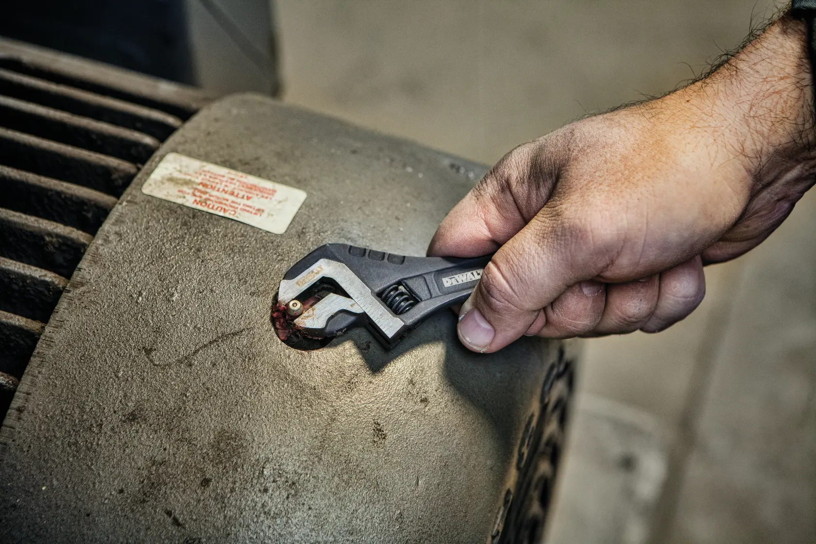 Close up of  6 inch All Steel Adjustable Wrench being used to adjust screws.