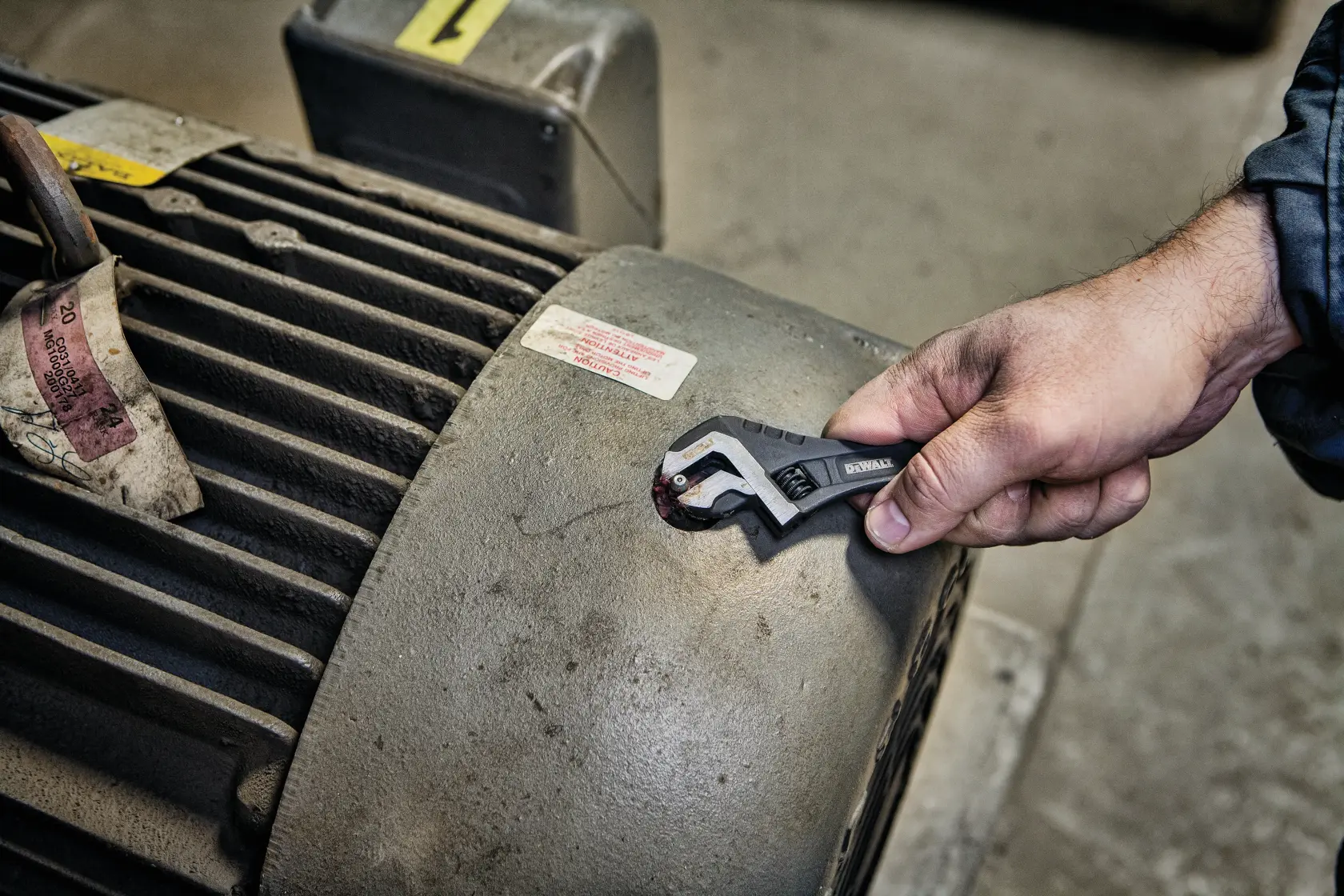 6 inch All Steel Adjustable Wrench being used to adjust screws.
