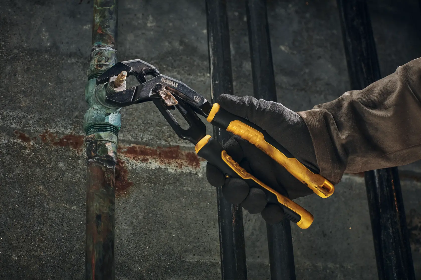 DEWALT Slidelock Pliers in use on a pipe