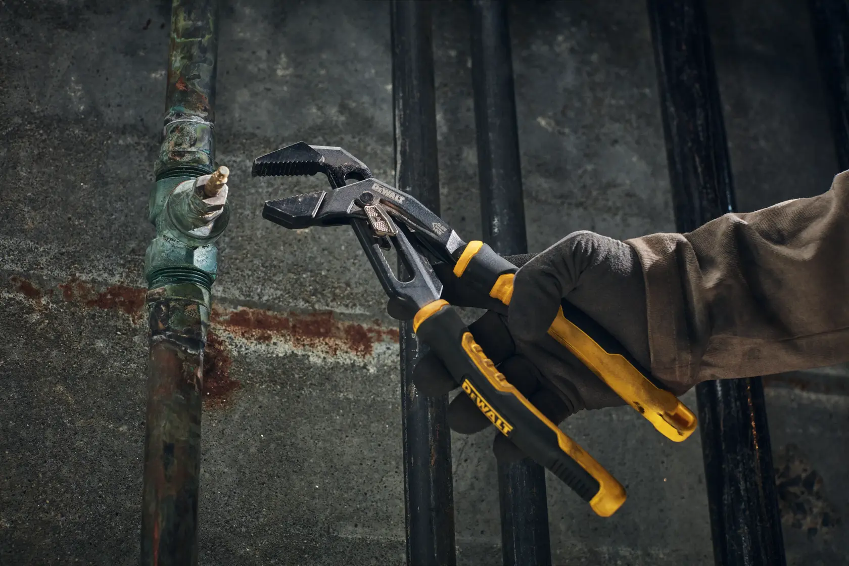 DEWALT Slidelock Pliers preparing for use on a pipe