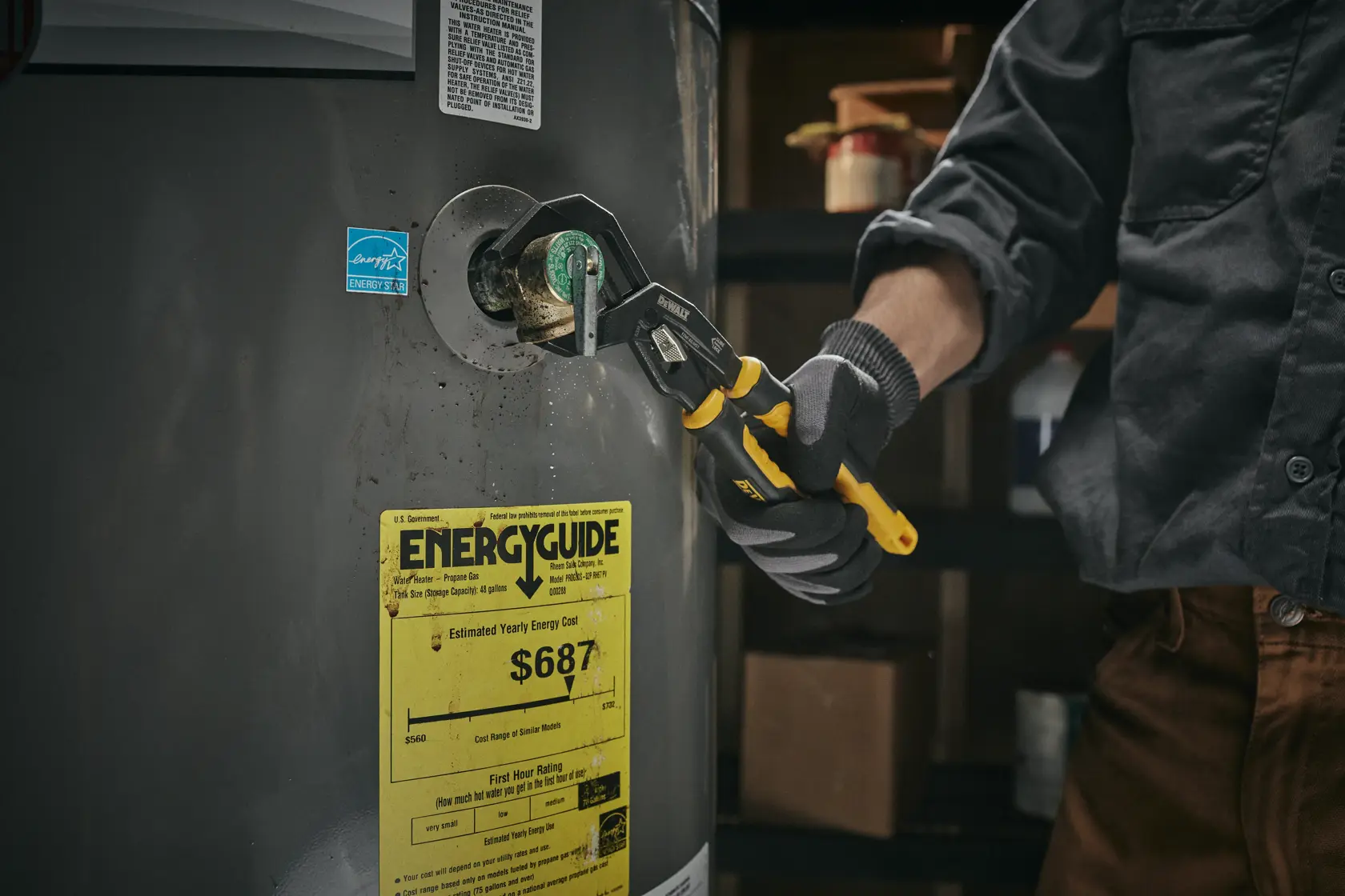 DEWALT Slidelock Pliers in use on a water tank pipe