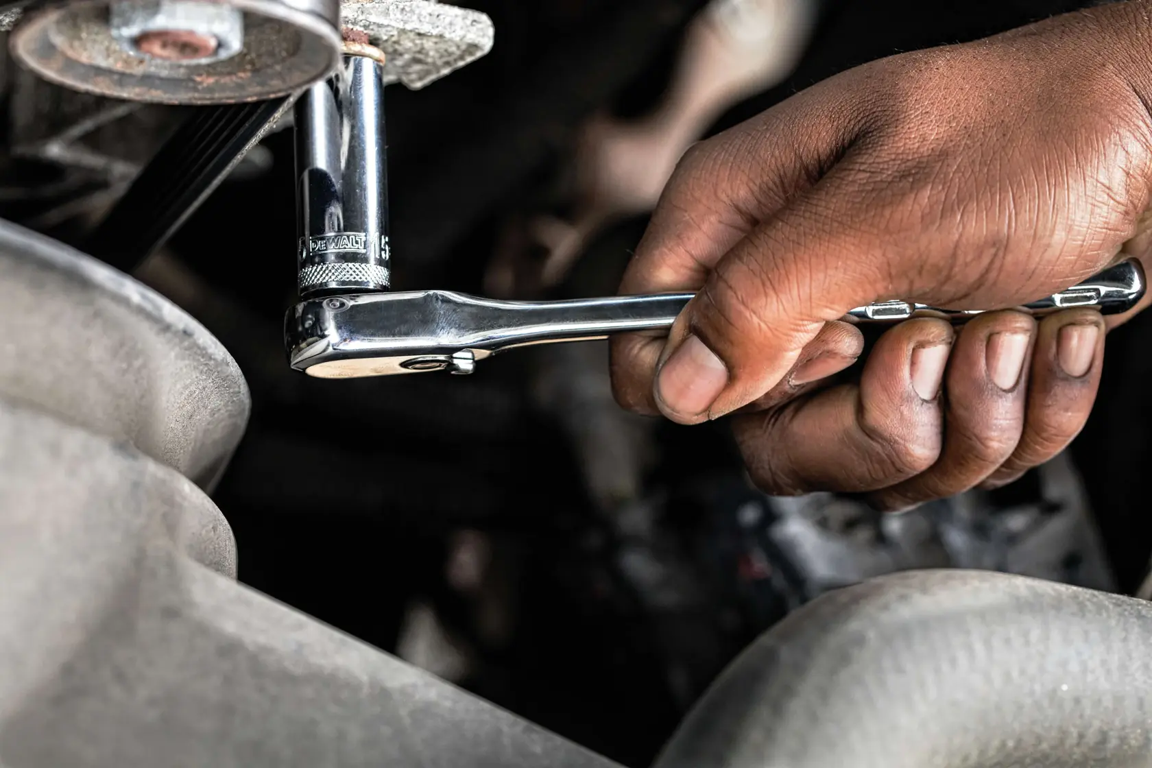 84 piece mechanics tool set being used on machinery.