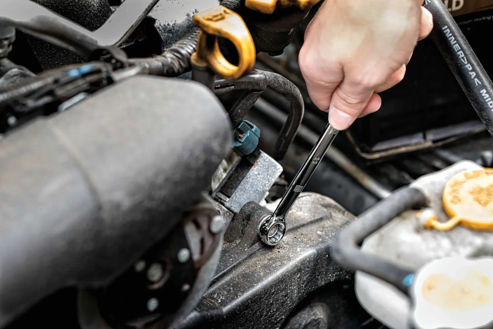 205 piece mechanics tool set being used on machinery.