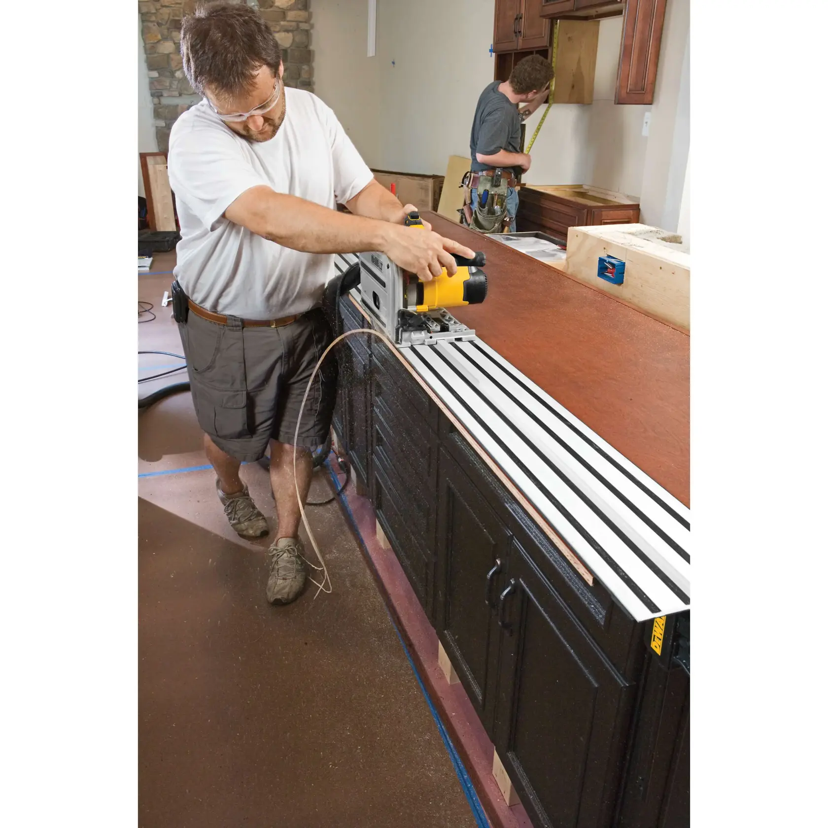 track saw kit being used by a person to cut wood.