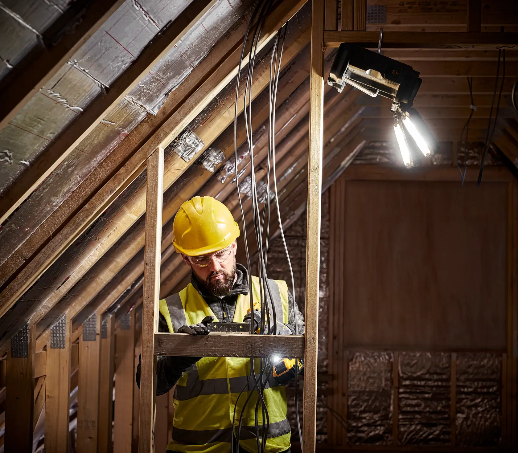Person Using the Brightness of the DEWALT TOUGHSYSTEM 2.0 ADJUSTABLE WORK LIGHT to Measure Material