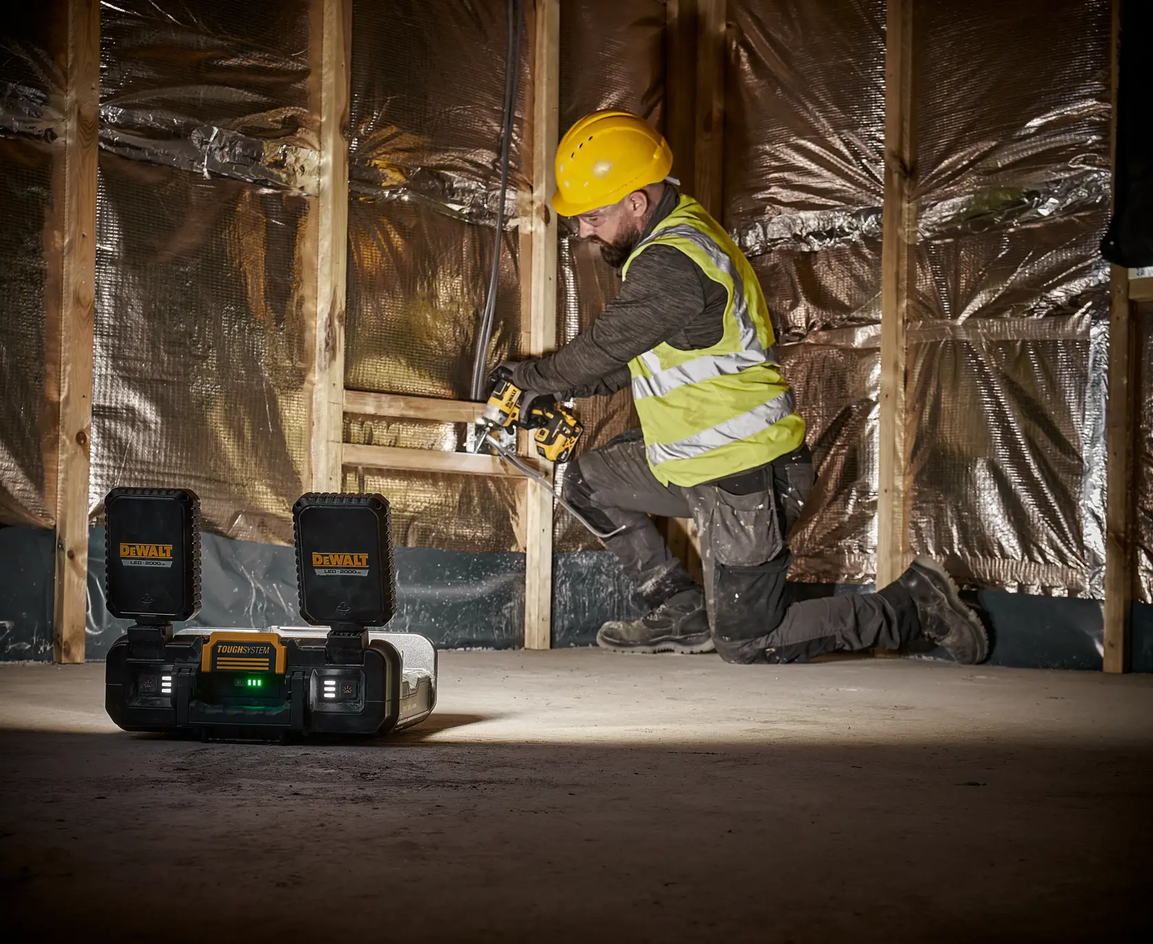 Person Using the Brightness of the DEWALT TOUGHSYSTEM 2.0 ADJUSTABLE WORK LIGHT to Drill Material