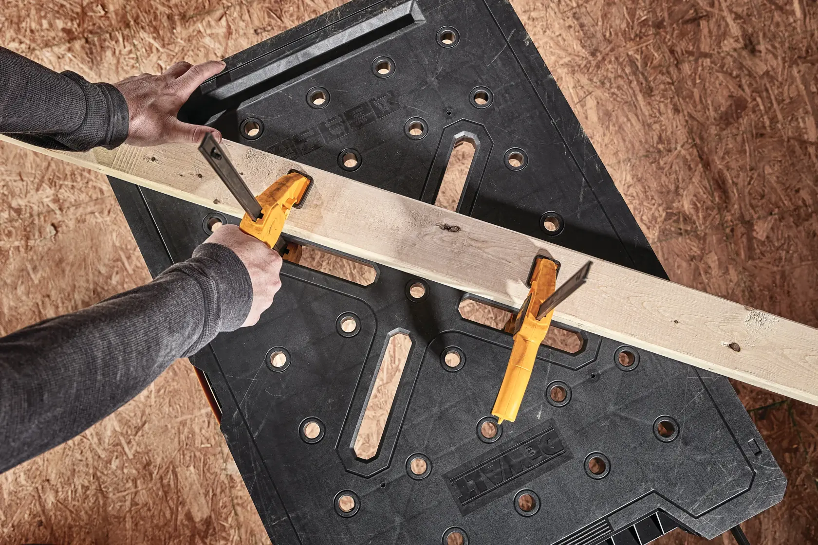 Express folding workbench holding a wooden plank.
