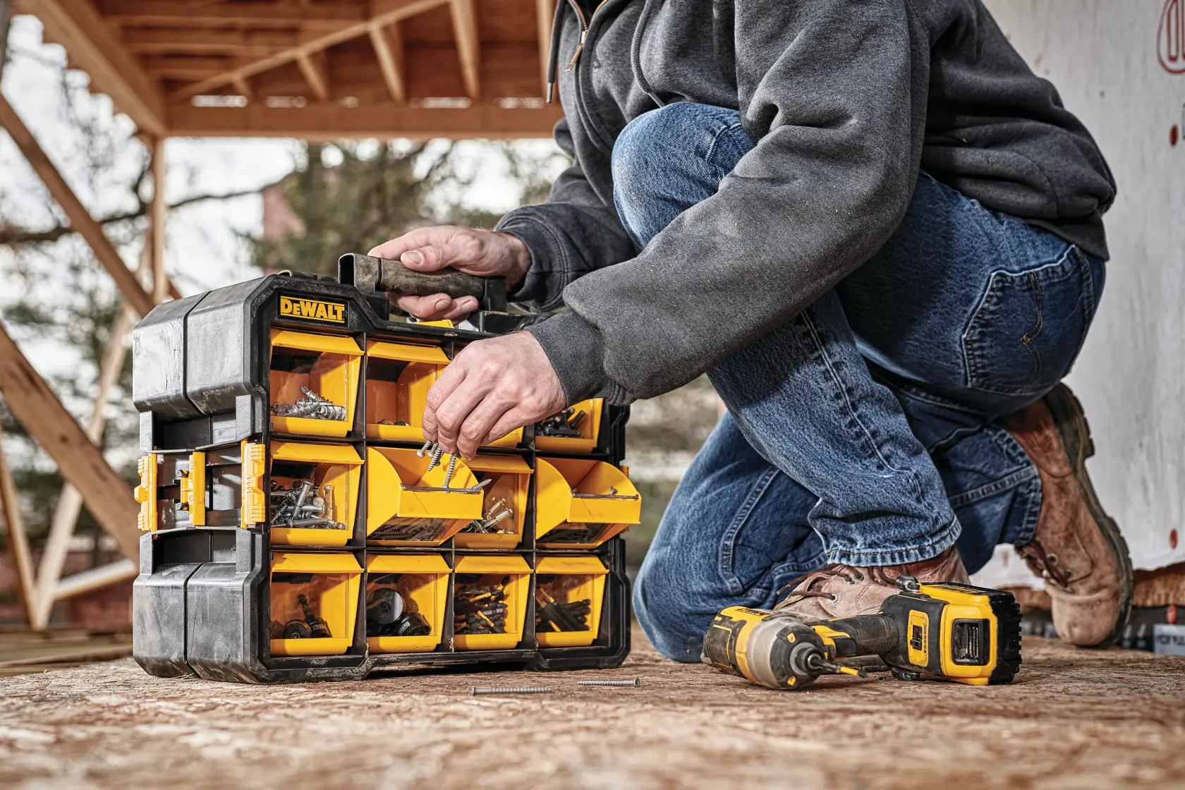 Flip bin organizer being used to store multiple nails for retrieval.