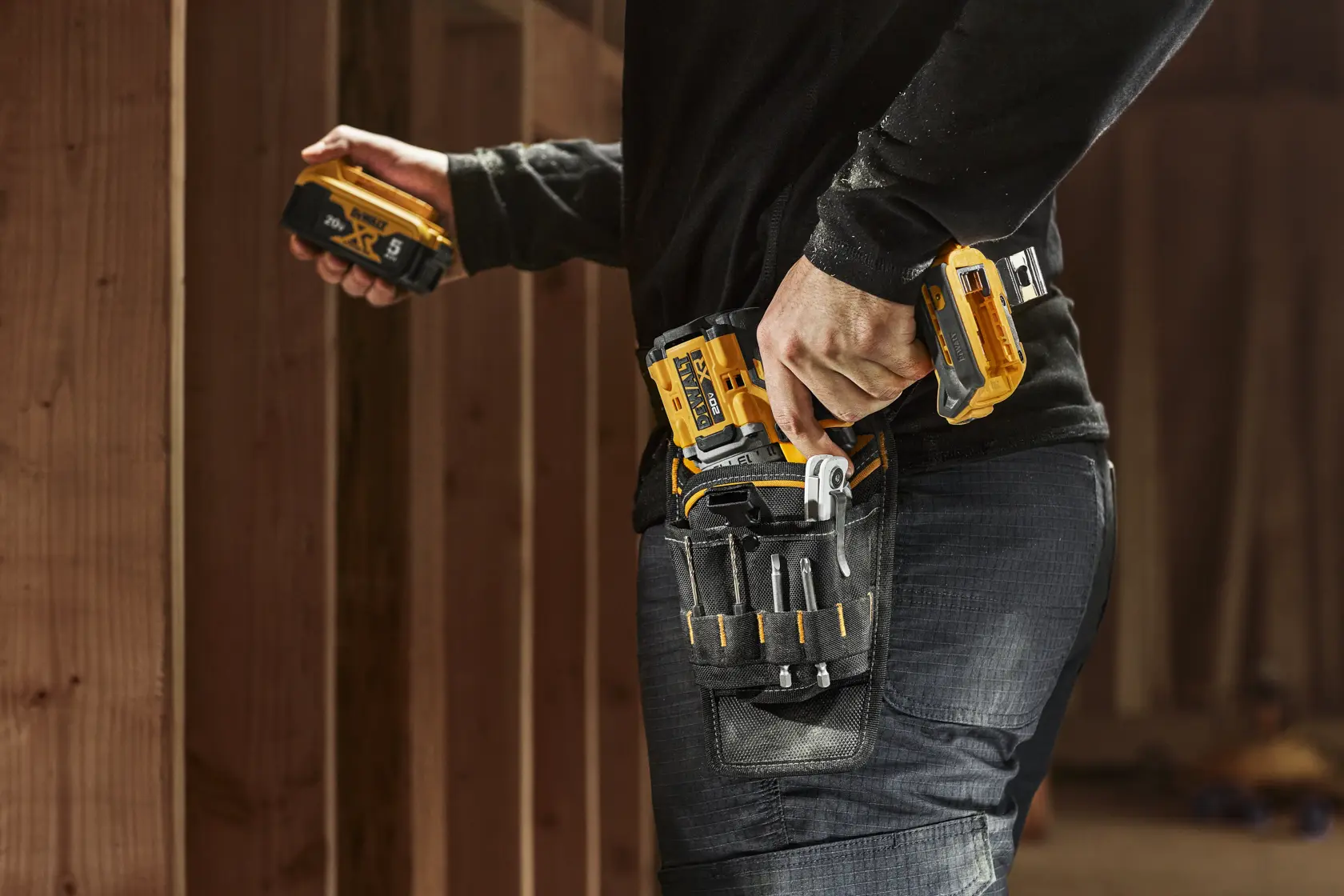 CONSTRUCTION WORKER WEARING DEWALT PROFESSIONAL DRILL HOLSTER