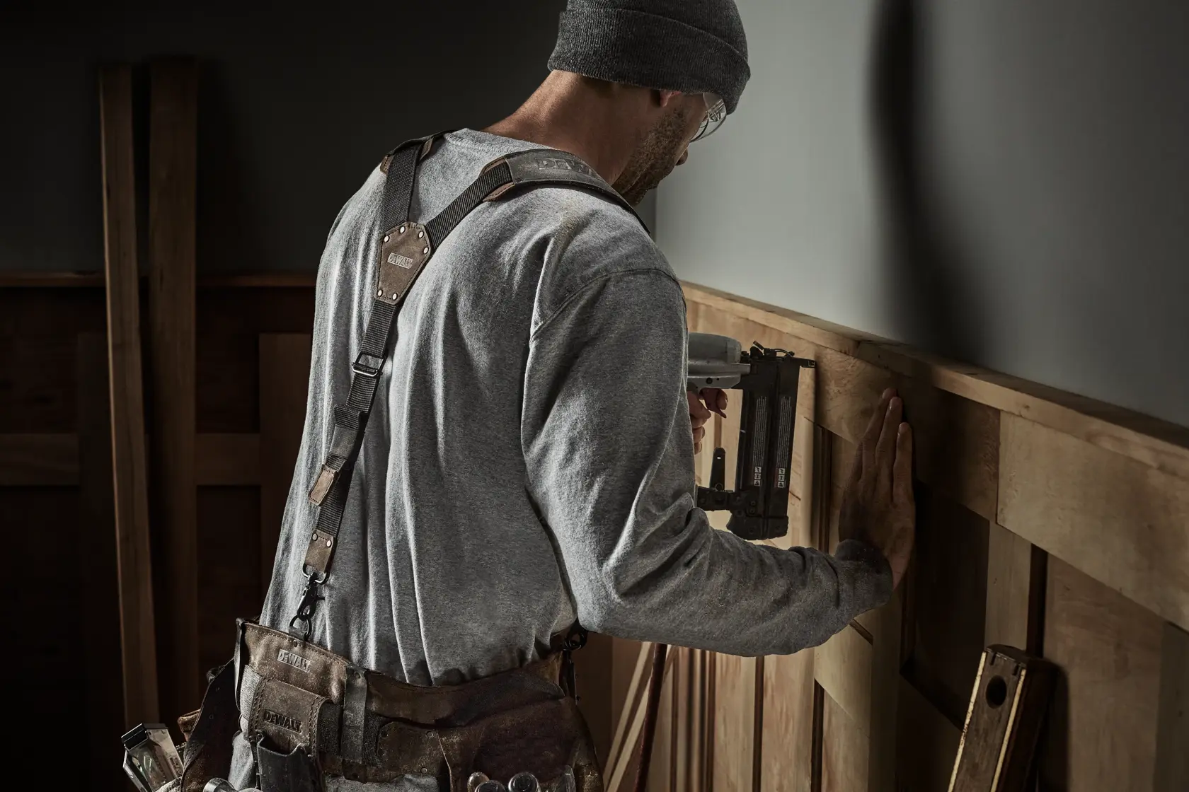 CONSTRUCTION WORKER WEARING DEWALT LEATHER TOOL BELT SUSPENDERS