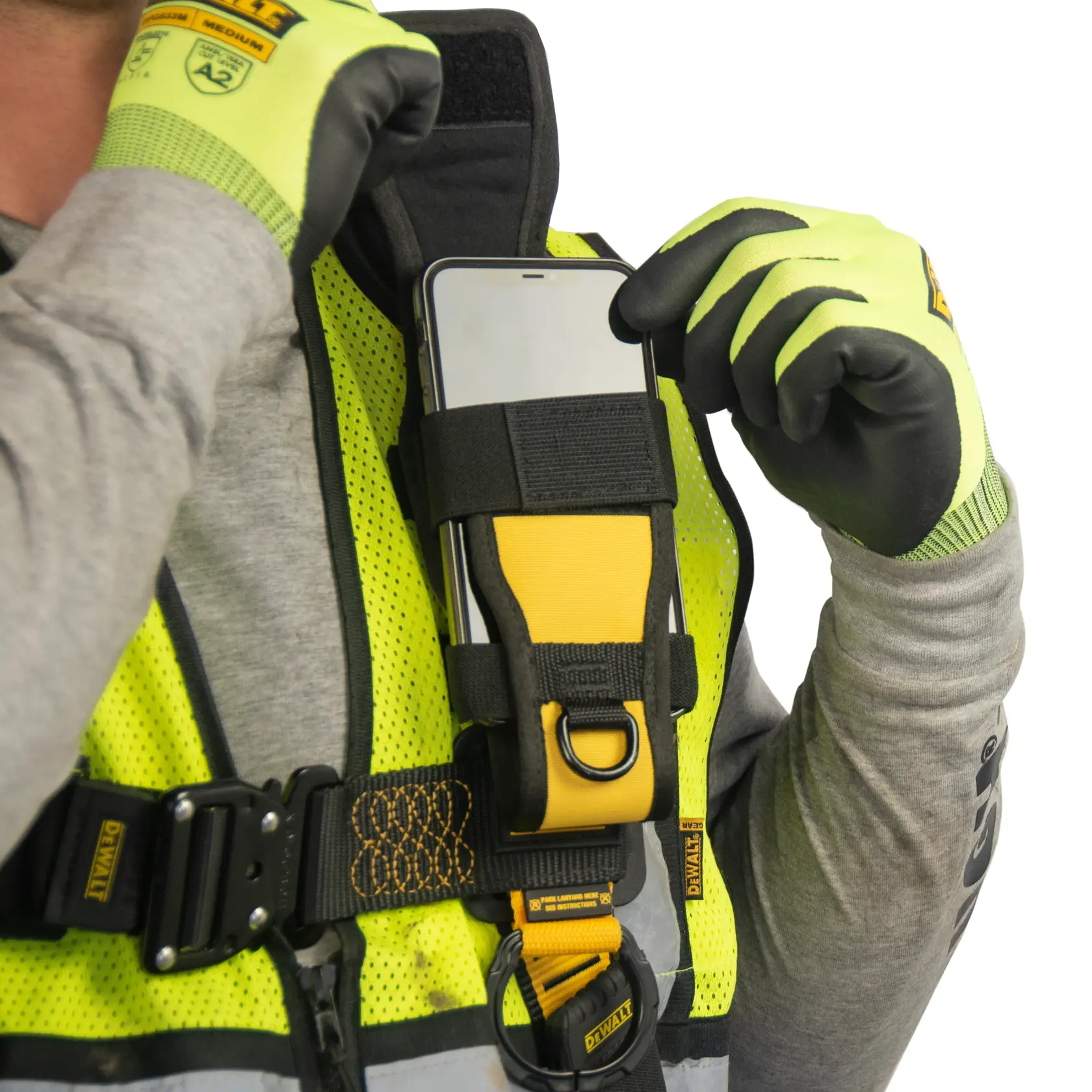 Close up front view of the DEWALT Radio /Mobile Phone Holder attached on DEWALT Harness